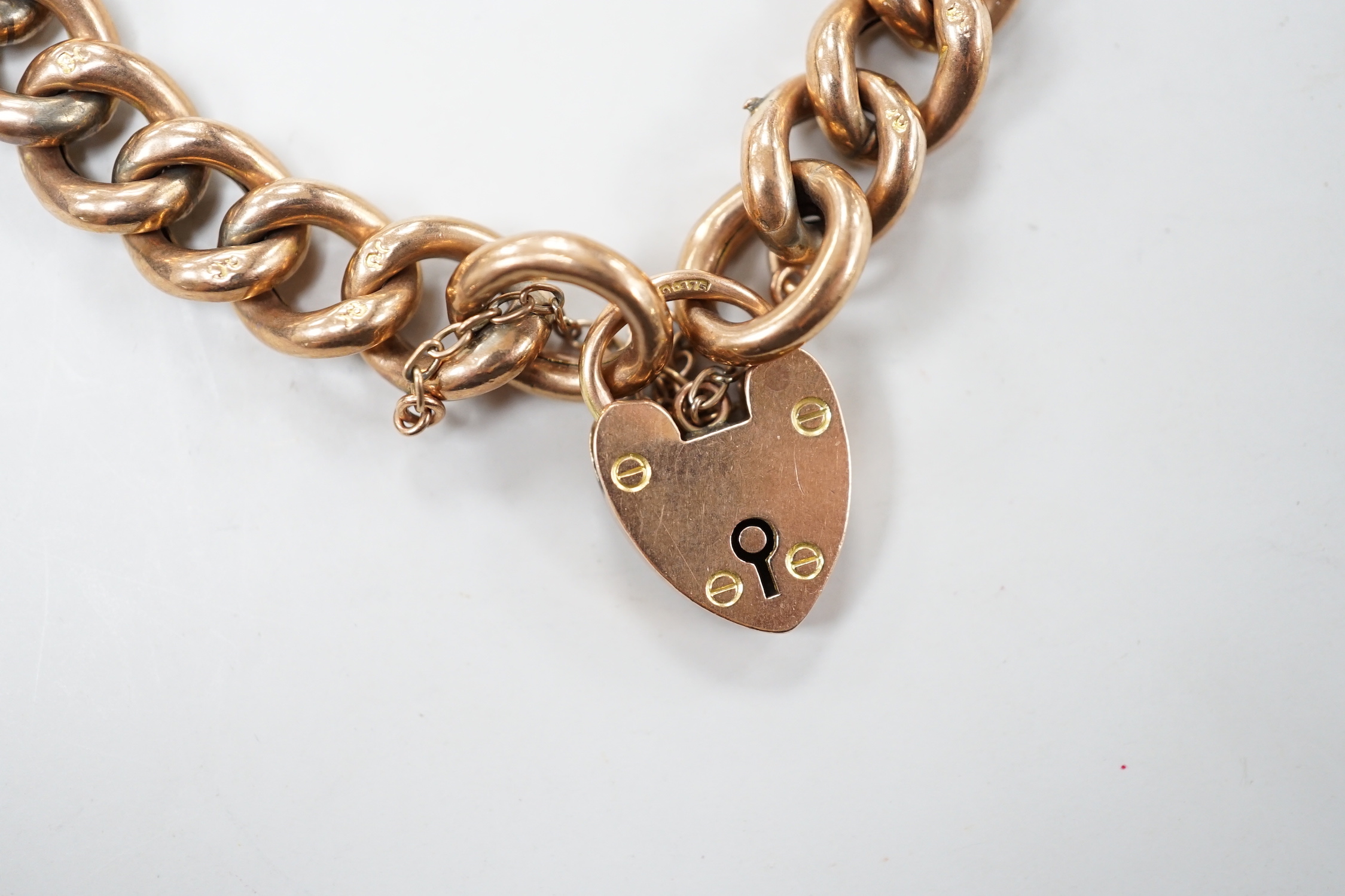 An Edwardian 9ct gold curb link bracelet, with heart shaped padlock clasp, 19cm, 16.2 grams.